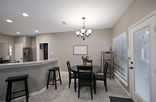 606 Brandt St, Grandview, TX 76050 - dining room with a chandelier, recessed lighting, plenty of natural light, light tile patterned floors, and baseboards