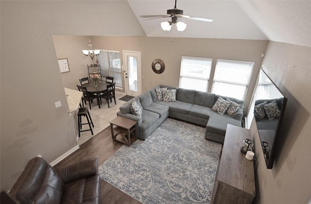 606 Brandt St, Grandview, TX 76050 - living area featuring vaulted ceiling, a chandelier, wood finished floors, ceiling fan, and baseboards