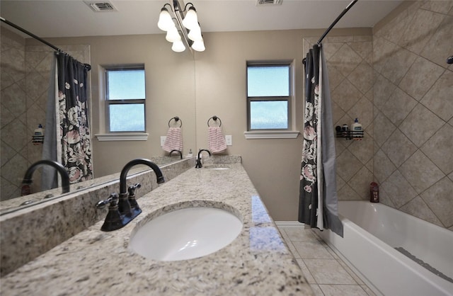 606 Brandt St, Grandview, TX 76050 - bathroom featuring tile patterned floors, plenty of natural light, shower / bathtub combination with curtain, and double vanity