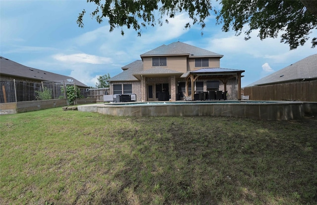 606 Brandt St, Grandview, TX 76050 - rear view of house with a gazebo and brick siding