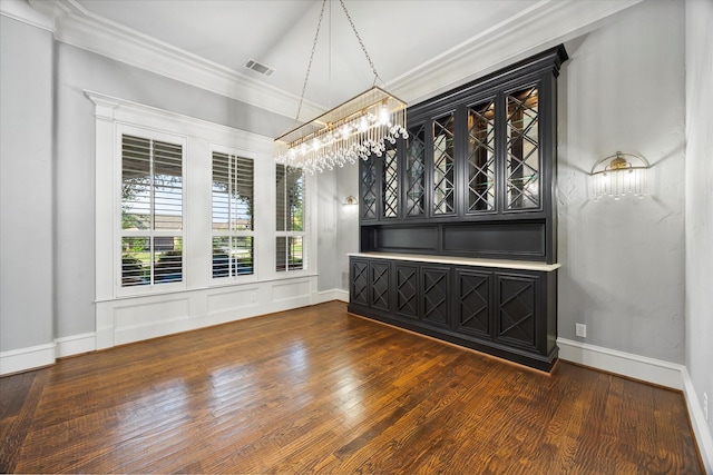 1229 Manchester Dr, Mclendon Chisholm, TX 75032 - unfurnished dining area featuring a chandelier, wood finished floors, ornamental molding, and baseboards
