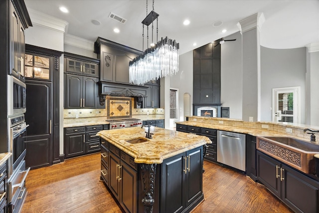1229 Manchester Dr, Mclendon Chisholm, TX 75032 - kitchen featuring appliances with stainless steel finishes, ornamental molding, a sink, decorative backsplash, and ceiling fan