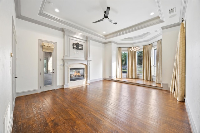 1229 Manchester Dr, Mclendon Chisholm, TX 75032 - unfurnished living room with a raised ceiling, wood finished floors, ceiling fan, a fireplace with flush hearth, and ornamental molding