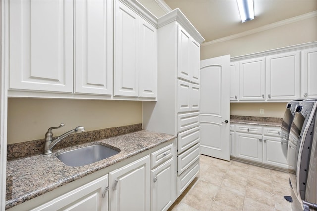 1229 Manchester Dr, Mclendon Chisholm, TX 75032 - kitchen with a sink, white cabinetry, ornamental molding, and light stone counters