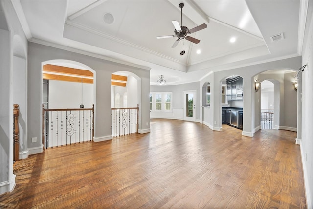1229 Manchester Dr, Mclendon Chisholm, TX 75032 - unfurnished living room featuring ceiling fan, wood finished floors, beamed ceiling, arched walkways, and baseboards