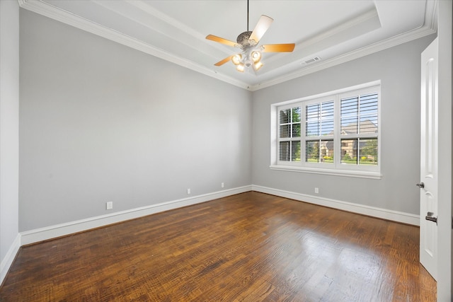 1229 Manchester Dr, Mclendon Chisholm, TX 75032 - empty room featuring dark wood-style floors, crown molding, ceiling fan, baseboards, and a tray ceiling
