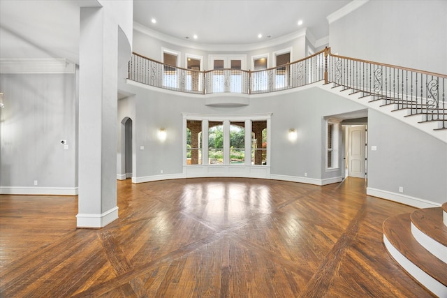 1229 Manchester Dr, Mclendon Chisholm, TX 75032 - unfurnished living room featuring ornamental molding, arched walkways, stairway, a towering ceiling, and baseboards