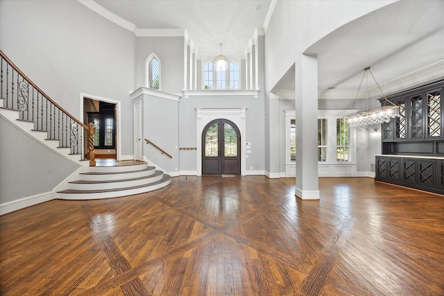 1229 Manchester Dr, Mclendon Chisholm, TX 75032 - foyer entrance featuring healthy amount of natural light, stairs, crown molding, a high ceiling, and arched walkways
