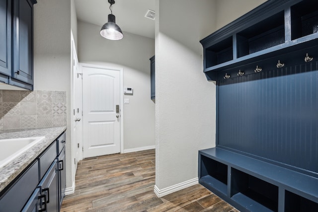 13609 Summer Moon Trl, Ponder, TX 76259 - mudroom with dark wood-style floors, baseboards, and a sink