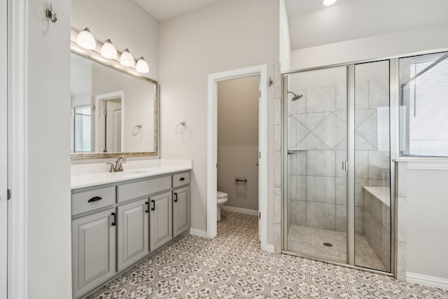 13609 Summer Moon Trl, Ponder, TX 76259 - bathroom with vanity, a shower stall, toilet, baseboards, and tile patterned floors