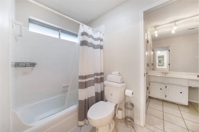 1715 Venetian Cir, Arlington, TX 76013 - full bath with toilet, vanity, shower / bath combination with curtain, tile patterned flooring, and rail lighting