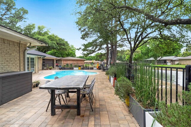 1715 Venetian Cir, Arlington, TX 76013 - view of swimming pool with a patio area and a fenced backyard