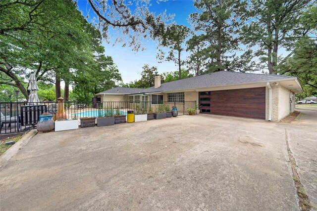 1715 Venetian Cir, Arlington, TX 76013 - view of front of house featuring an attached garage, a chimney, driveway, and brick siding