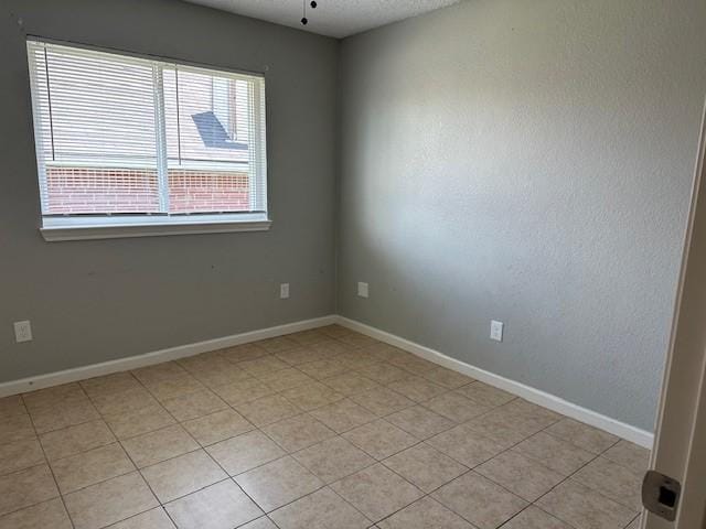 1042 Kim Ln, Mesquite, TX 75149 - empty room with baseboards and light tile patterned floors