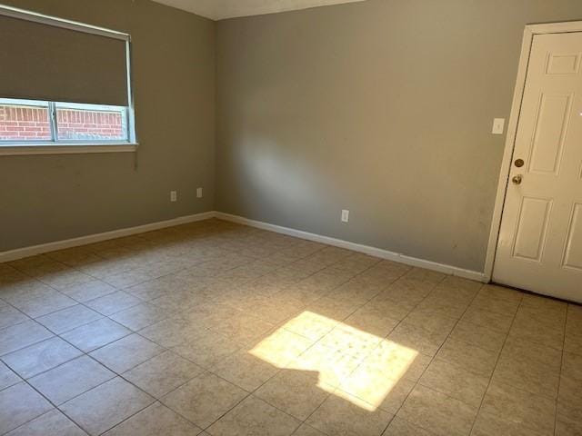 1042 Kim Ln, Mesquite, TX 75149 - spare room featuring baseboards and tile patterned floors