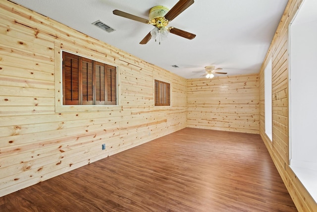791 Cedar Oak Dr, Pottsboro, TX 75076 - empty room featuring ceiling fan, wood finished floors, and wooden walls