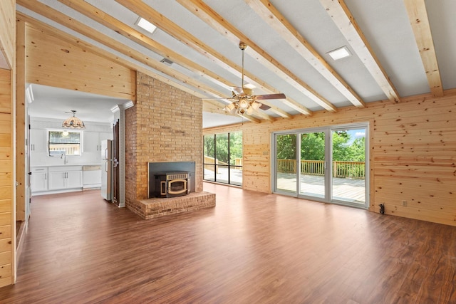 791 Cedar Oak Dr, Pottsboro, TX 75076 - unfurnished living room with wood finished floors, healthy amount of natural light, a sink, wooden walls, and a ceiling fan