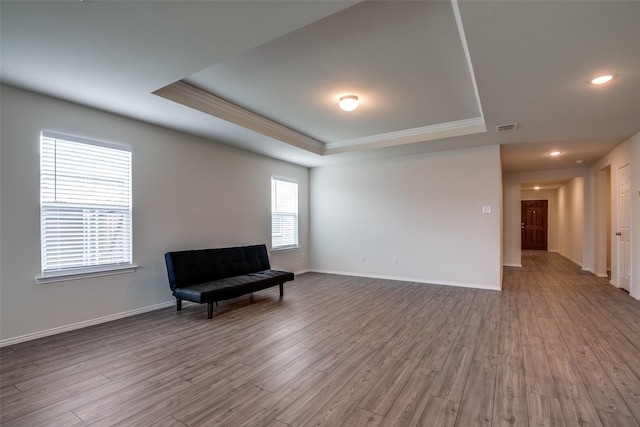 1609 Silas Dr, Forney, TX 75126 - living area with a raised ceiling, crown molding, wood finished floors, recessed lighting, and baseboards