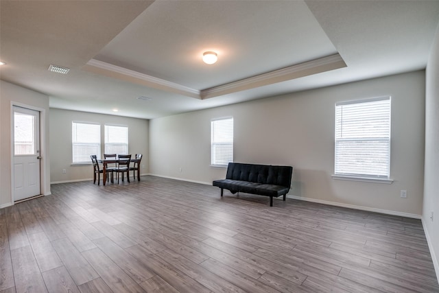 1609 Silas Dr, Forney, TX 75126 - sitting room featuring a raised ceiling, ornamental molding, wood finished floors, and plenty of natural light