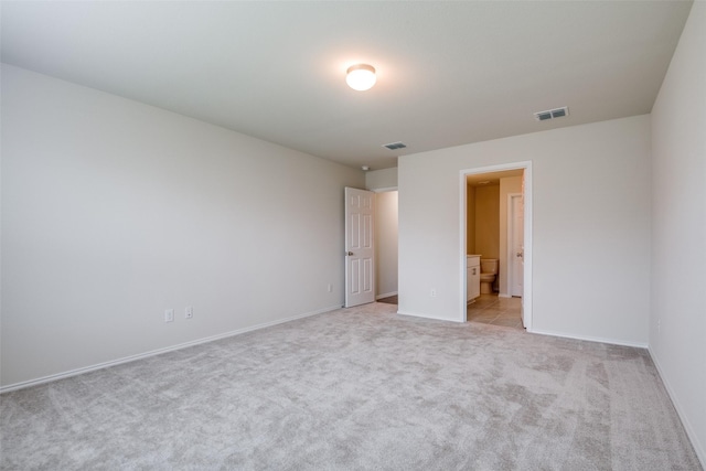 1609 Silas Dr, Forney, TX 75126 - unfurnished bedroom featuring light colored carpet, baseboards, and ensuite bathroom