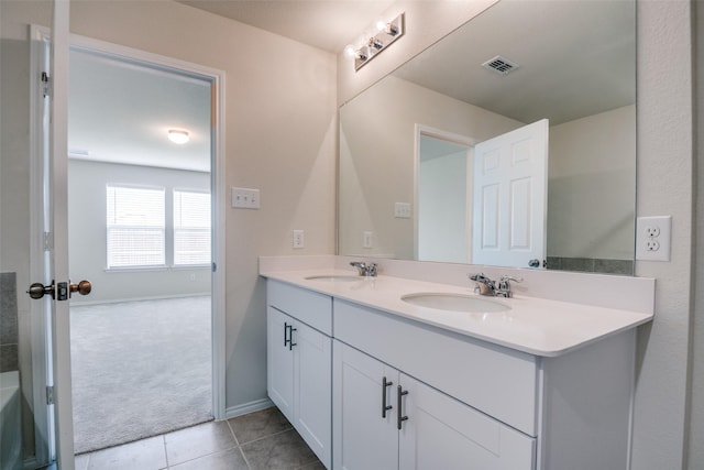 1609 Silas Dr, Forney, TX 75126 - full bath featuring double vanity, tile patterned flooring, and baseboards