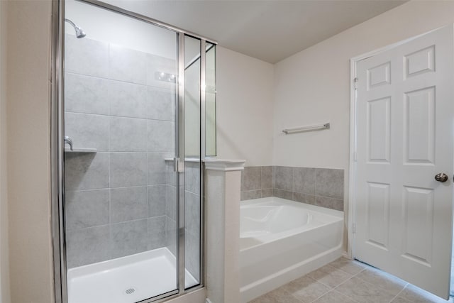 1609 Silas Dr, Forney, TX 75126 - bathroom featuring a shower stall, a bath, and tile patterned flooring