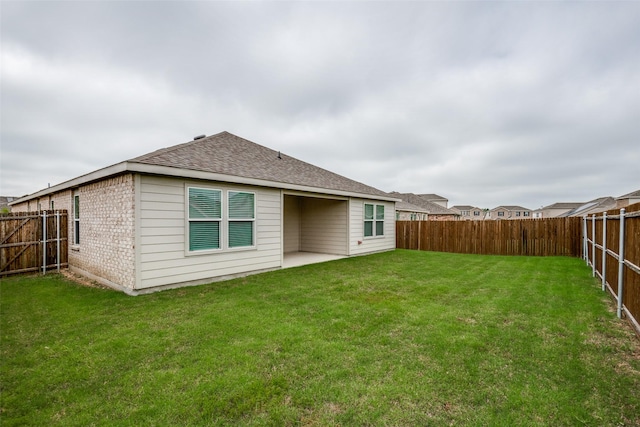 1609 Silas Dr, Forney, TX 75126 - back of house with roof with shingles, brick siding, and a patio area