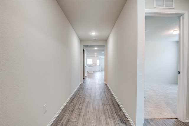 1609 Silas Dr, Forney, TX 75126 - hallway featuring wood finished floors, baseboards, and recessed lighting
