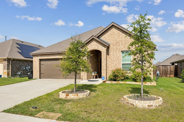 152 Whitetail Way, Caddo Mills, TX 75135 - view of front of home with brick siding, a garage, driveway, and a shingled roof