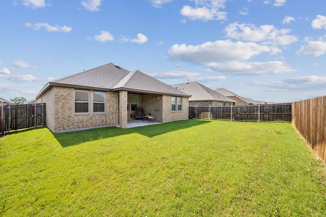 152 Whitetail Way, Caddo Mills, TX 75135 - rear view of house featuring brick siding, a patio, and a shingled roof