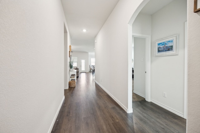 152 Whitetail Way, Caddo Mills, TX 75135 - hall featuring arched walkways, dark wood-type flooring, recessed lighting, and baseboards