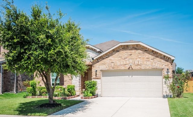 2225 Bernese Ln, Fort Worth, TX 76131 - view of front of property featuring a garage, driveway, a front yard, and brick siding