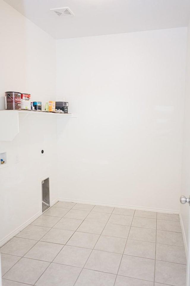 2225 Bernese Ln, Fort Worth, TX 76131 - washroom featuring hookup for a washing machine, baseboards, light tile patterned floors, and hookup for an electric dryer