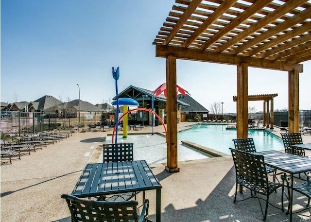 2225 Bernese Ln, Fort Worth, TX 76131 - community pool with a pergola, outdoor dining space, and a patio area