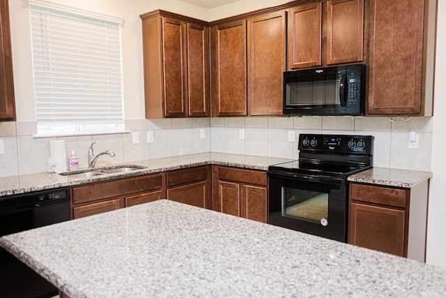 2225 Bernese Ln, Fort Worth, TX 76131 - kitchen with black appliances, a sink, tasteful backsplash, and light stone counters