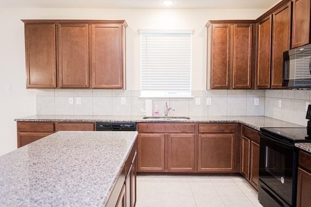 2225 Bernese Ln, Fort Worth, TX 76131 - kitchen with black appliances, a sink, light stone countertops, backsplash, and light tile patterned flooring
