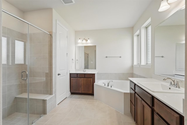 517 Fenwick Dr, Sunnyvale, TX 75182 - full bathroom featuring a shower stall, two vanities, a garden tub, and tile patterned flooring