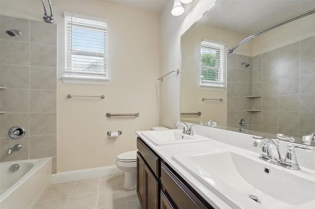 517 Fenwick Dr, Sunnyvale, TX 75182 - bathroom with washtub / shower combination, tile patterned floors, double vanity, baseboards, and toilet