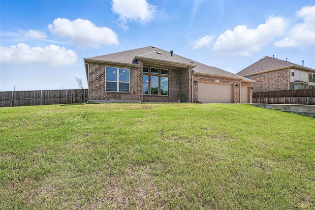 517 Fenwick Dr, Sunnyvale, TX 75182 - back of house featuring an attached garage, brick siding, and a shingled roof