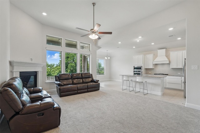 517 Fenwick Dr, Sunnyvale, TX 75182 - living area with light colored carpet, recessed lighting, a ceiling fan, a glass covered fireplace, and baseboards