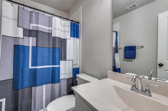 1502 Wild Indigo Dr, Mansfield, TX 76063 - bathroom with toilet, vanity, a textured wall, and a shower with curtain