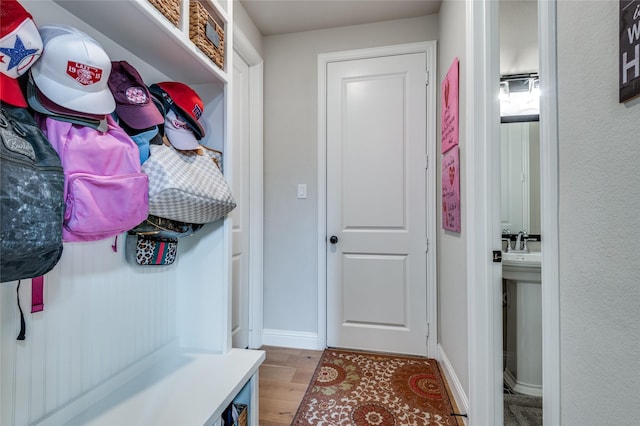 1502 Wild Indigo Dr, Mansfield, TX 76063 - mudroom featuring light wood-style floors and baseboards