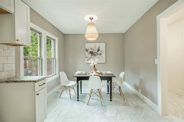 1225 Sayles Blvd, Abilene, TX 79605 - dining area with light marble finish floors and baseboards