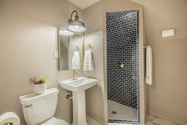 1225 Sayles Blvd, Abilene, TX 79605 - full bathroom featuring toilet, a shower stall, marble finish flooring, and baseboards
