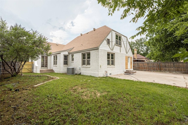 1225 Sayles Blvd, Abilene, TX 79605 - rear view of house with cooling unit, a patio area, brick siding, roof with shingles, and entry steps