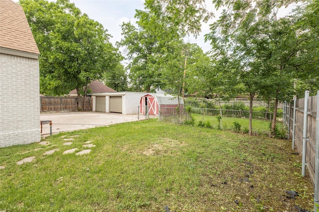 1225 Sayles Blvd, Abilene, TX 79605 - view of yard with a garage, an outdoor structure, and a patio
