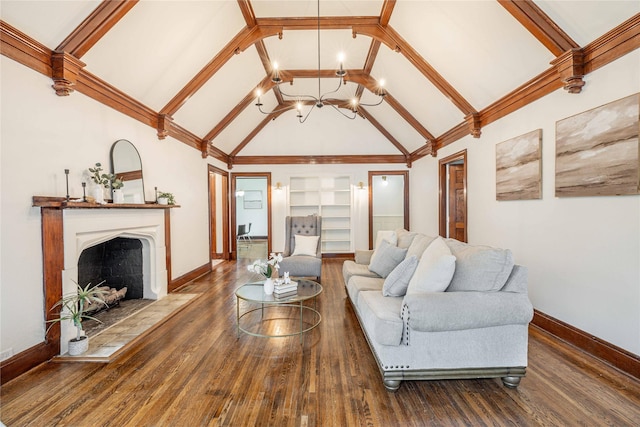 1225 Sayles Blvd, Abilene, TX 79605 - living area with built in shelves, wood finished floors, baseboards, a fireplace with raised hearth, and high vaulted ceiling