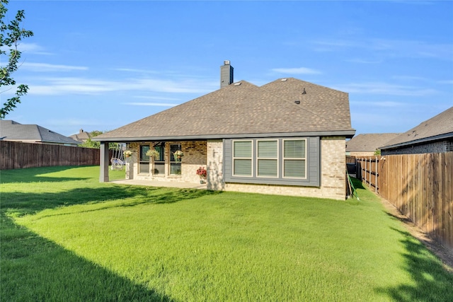 1621 Whispering Trail Dr, Waxahachie, TX 75165 - back of house with brick siding, a chimney, and a shingled roof
