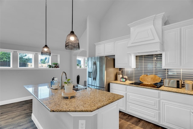 1621 Whispering Trail Dr, Waxahachie, TX 75165 - kitchen featuring black electric stovetop, stainless steel fridge with ice dispenser, tasteful backsplash, custom range hood, and white cabinetry
