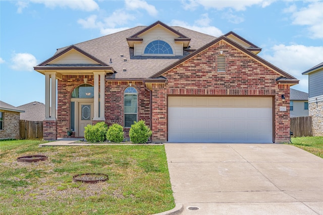 11212 Haviture Way, Waco, TX 76708 - traditional-style house featuring brick siding, a shingled roof, driveway, and an attached garage